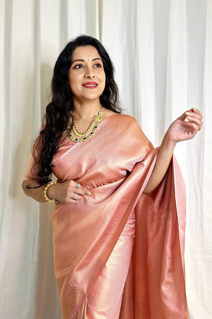 Incomparable Peach Soft Banarasi Silk Saree With Exquisite Blouse Piece