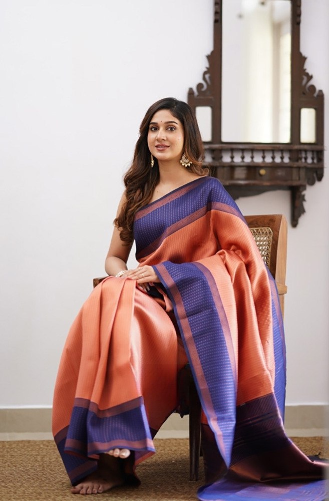 Hypnotic Peach Color Soft Banarasi Silk Saree With Artistic Blouse Piece