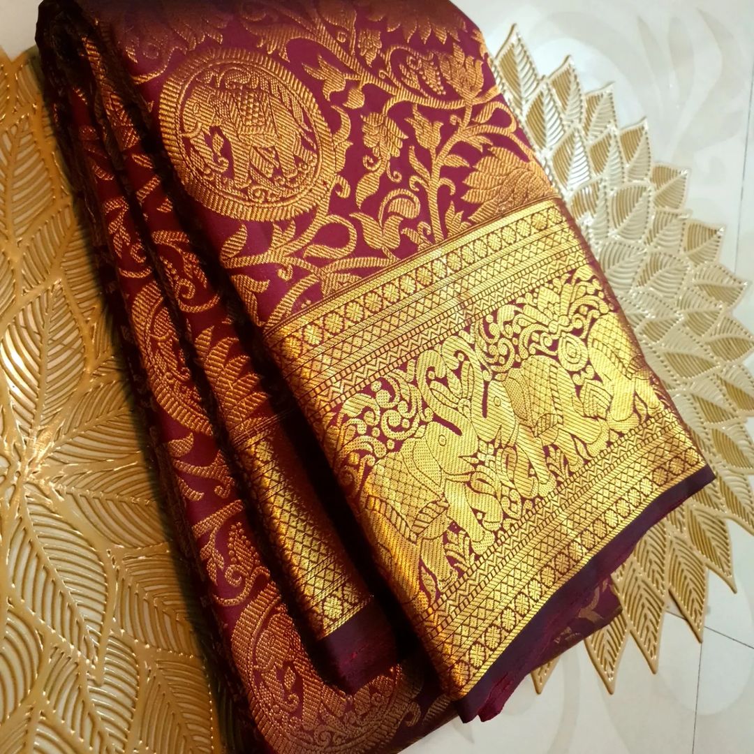 Sensational Maroon Soft Banarasi Silk Saree With Sempiternal Blouse Piece