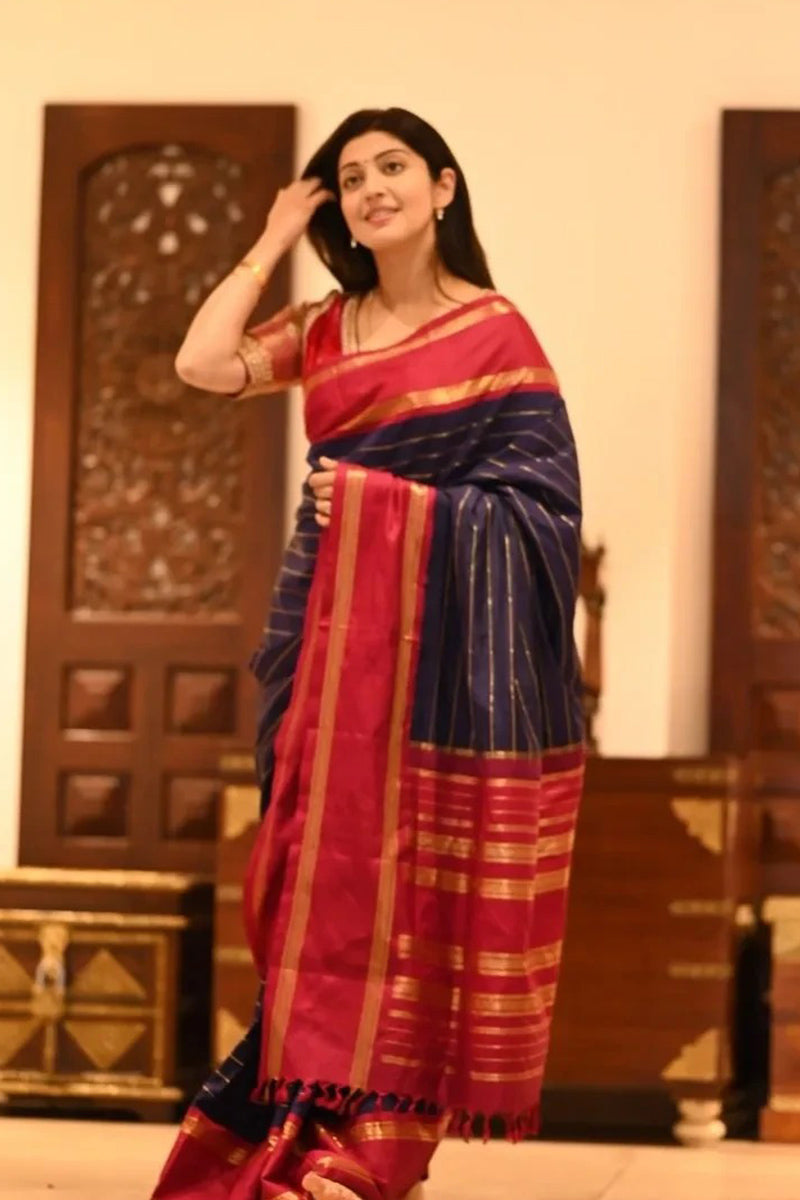 Eye-catching Navy Blue Soft Silk Saree With Sumptuous Blouse Piece