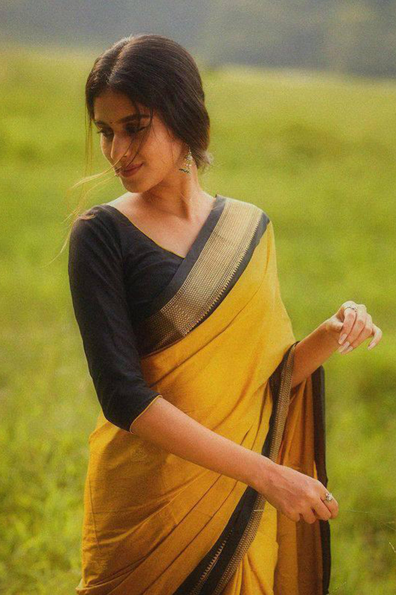 Enticing Yellow Soft Silk Saree With Blouse Piece