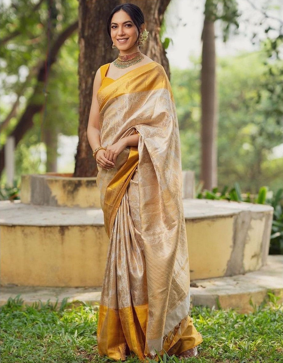 Snappy Beige Soft Banarasi Silk Saree With Desultory Blouse Piece