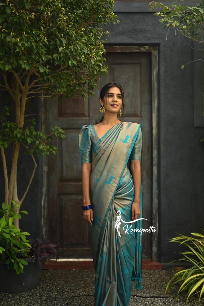 Glowing Rama Color Soft Silk Saree With Blouse Piece