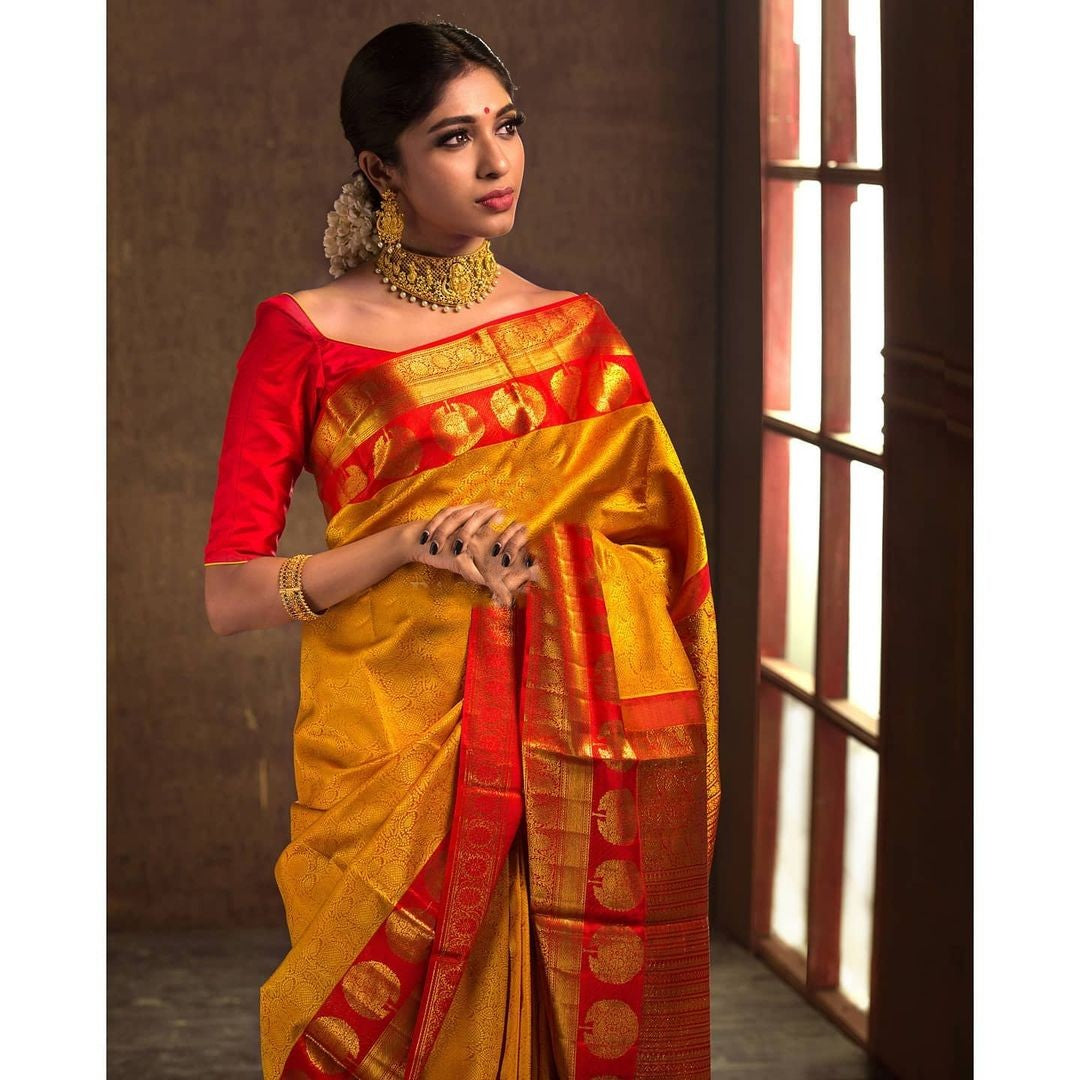 Cynosure Yellow Color Soft Silk Saree With Blouse Piece