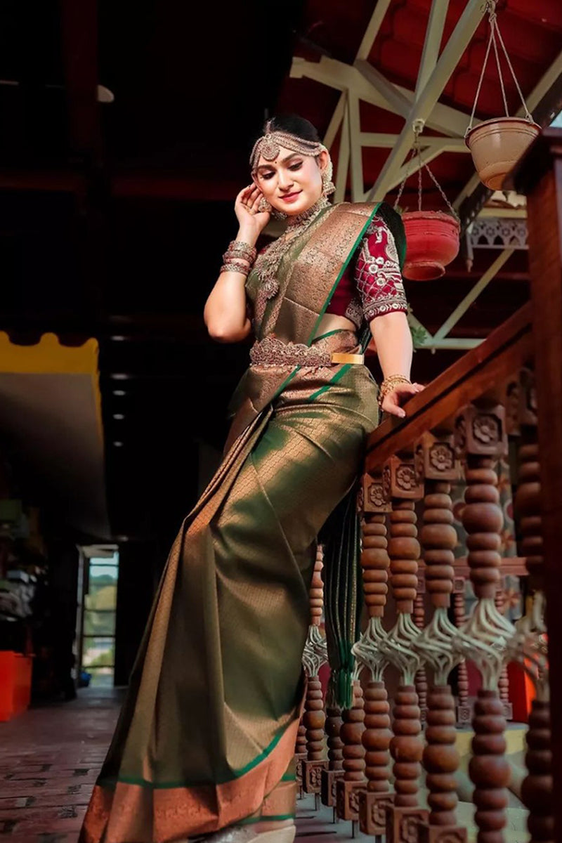 Elision Green Color Soft Banarasi Silk Saree With Blouse Piece